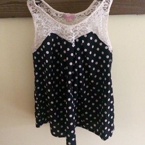 Polka dot top with lace trim near neckline. NWOT